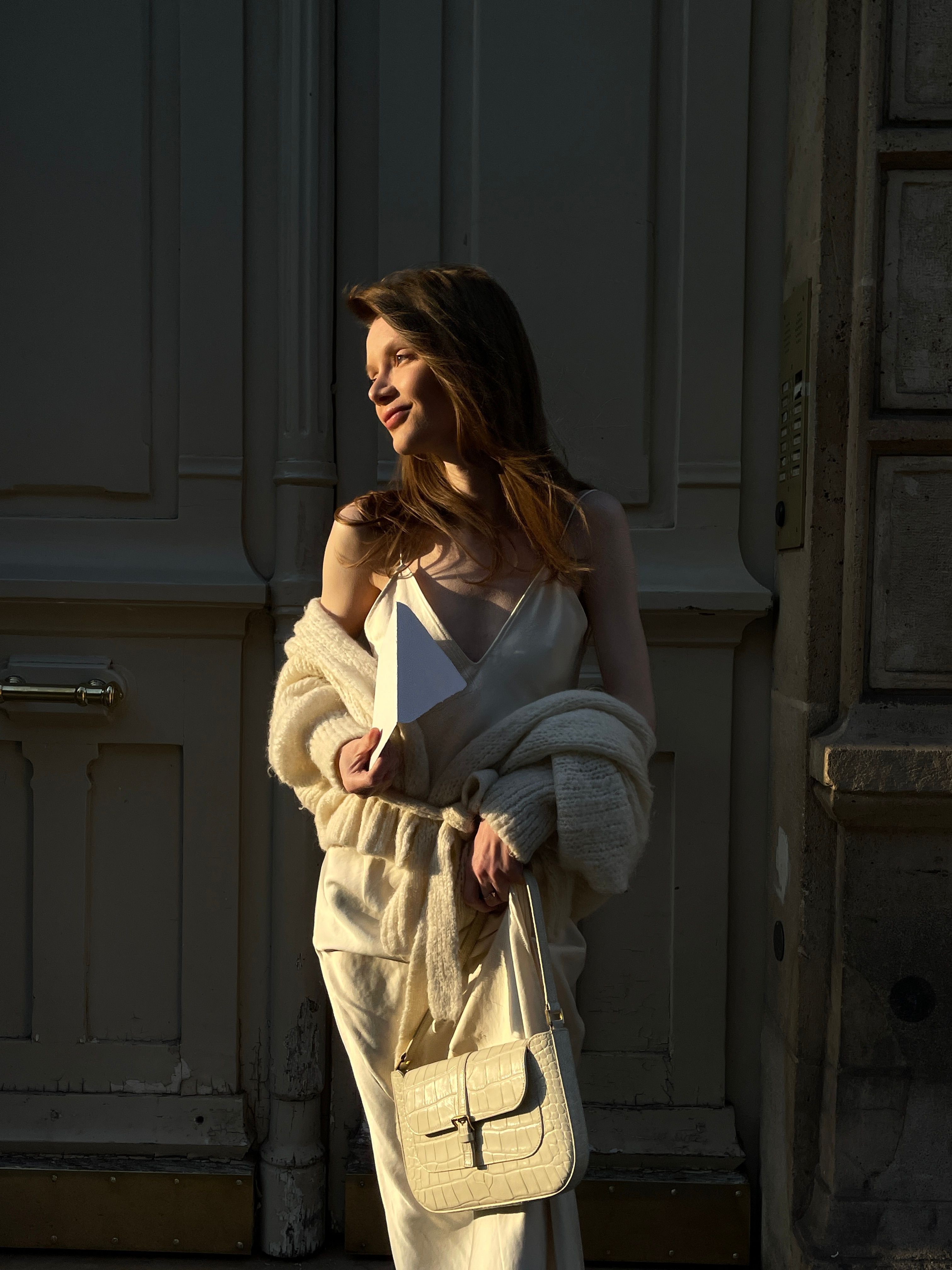 Slip dress layered under a cozy cardigan