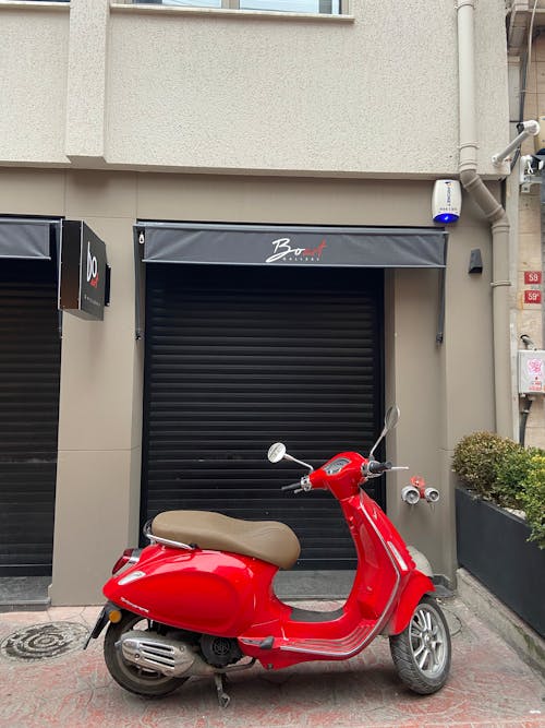 Red Vespa Motor Scooter