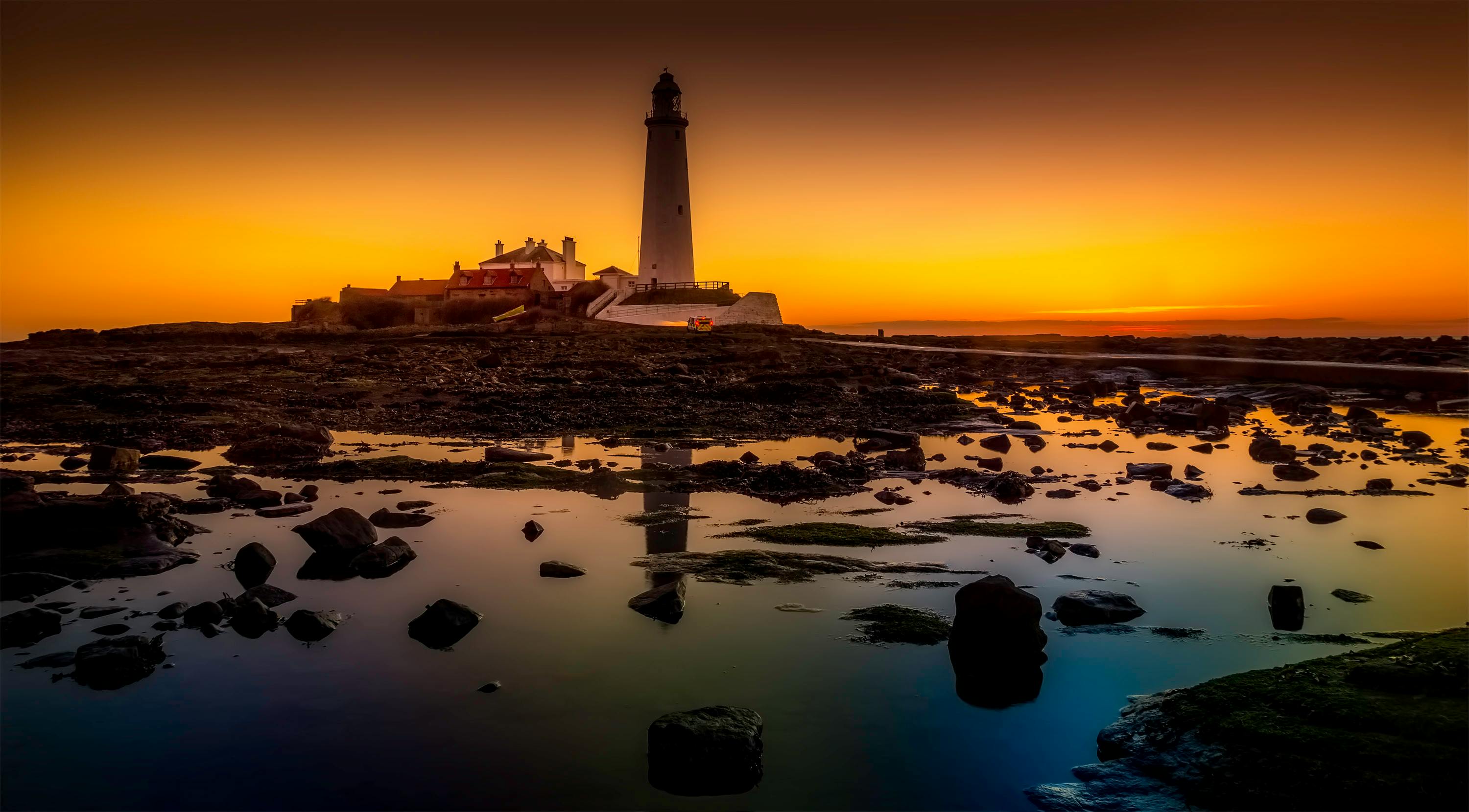 White Lighthouse Under Cloudy Sky · Free Stock Photo