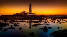 White Lighthouse Under Sunset