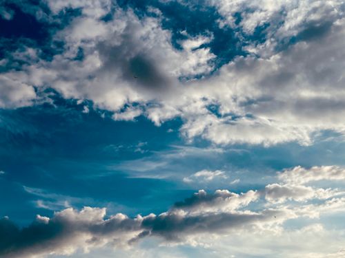 Free Beautiful cloud formations against a clear blue sky, capturing the essence of the English weather. Stock Photo
