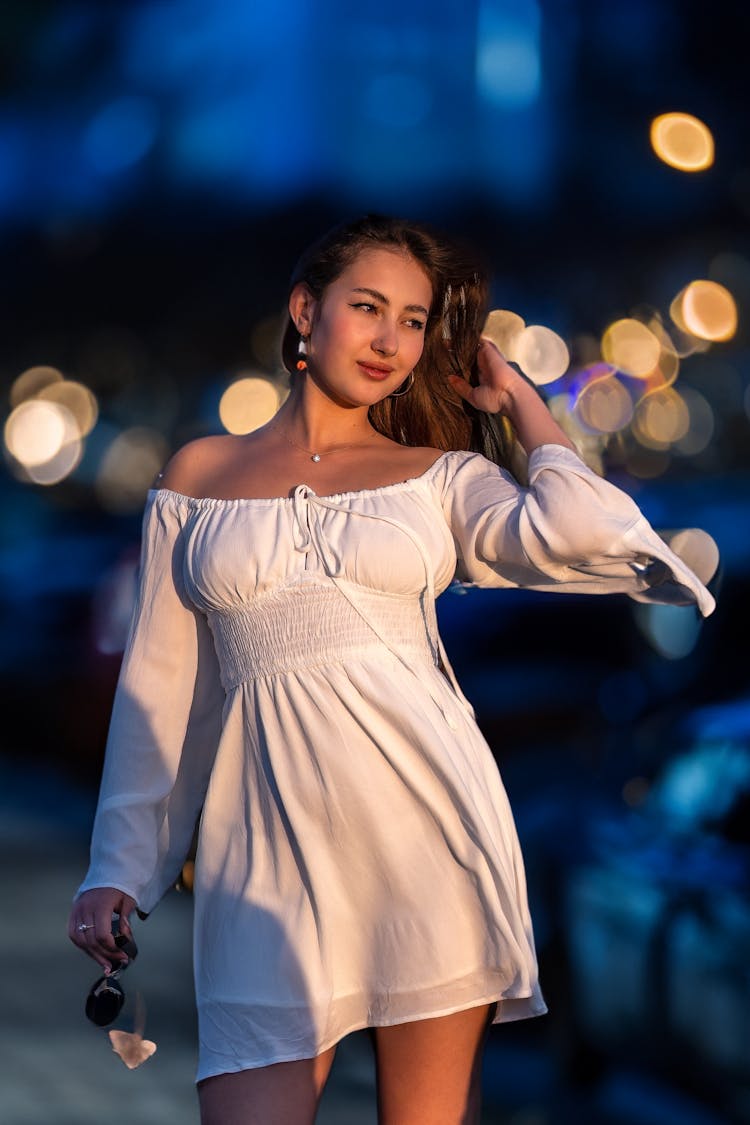 Young Woman In Dress Walking In Night City