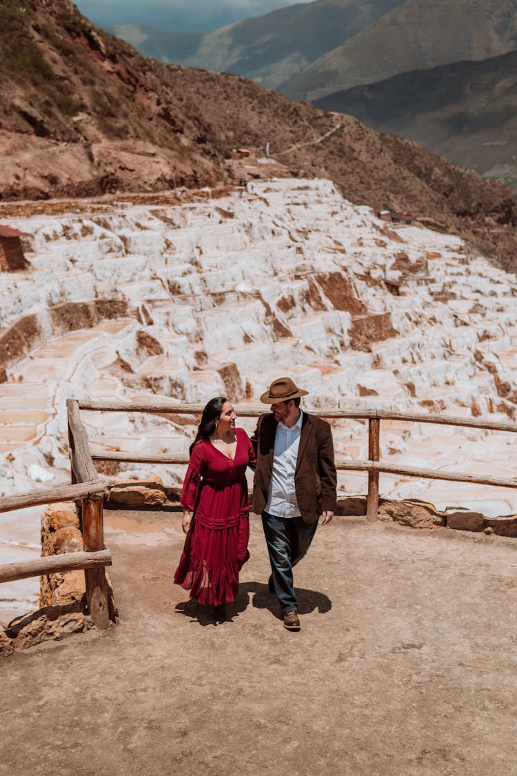 Elegant Man And Woman Standing At The Lookout Point In Mountains 