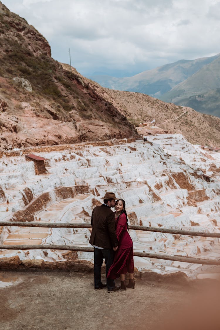 Elegant Man And Woman Standing At The Lookout Point In Mountains 