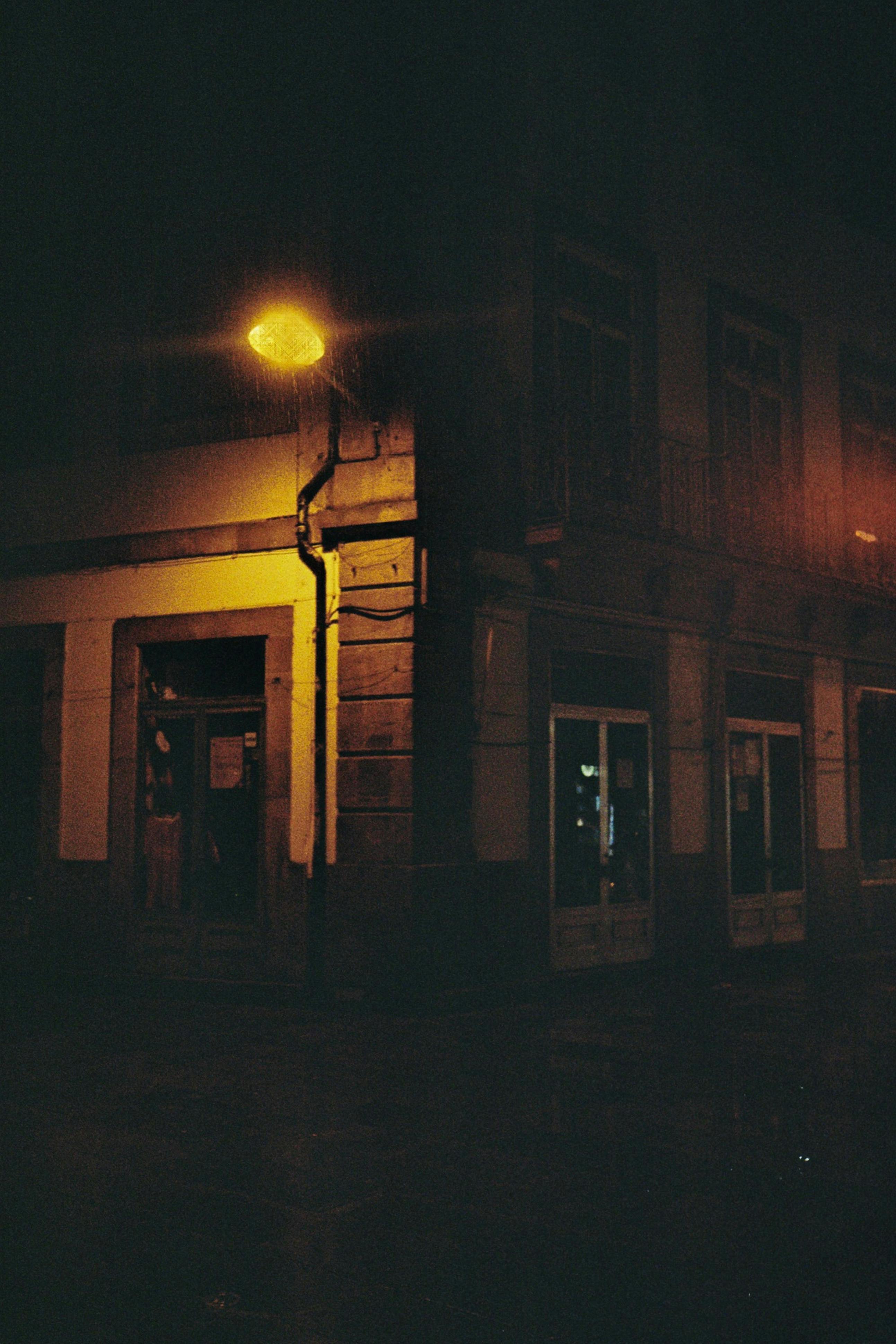 Free Dramatic nighttime view of a dimly lit street corner in Barcelos, Portugal, capturing urban ambiance. Stock Photo