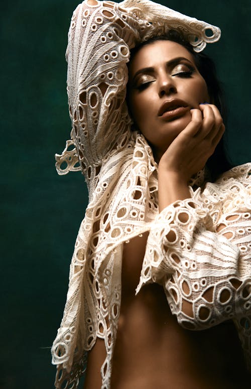 Woman in White Clothes Posing with Eyes Closed