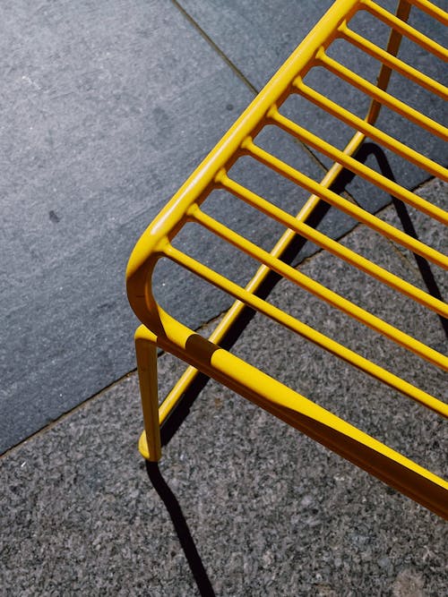 Yellow Chair Standing on a Concrete Surface