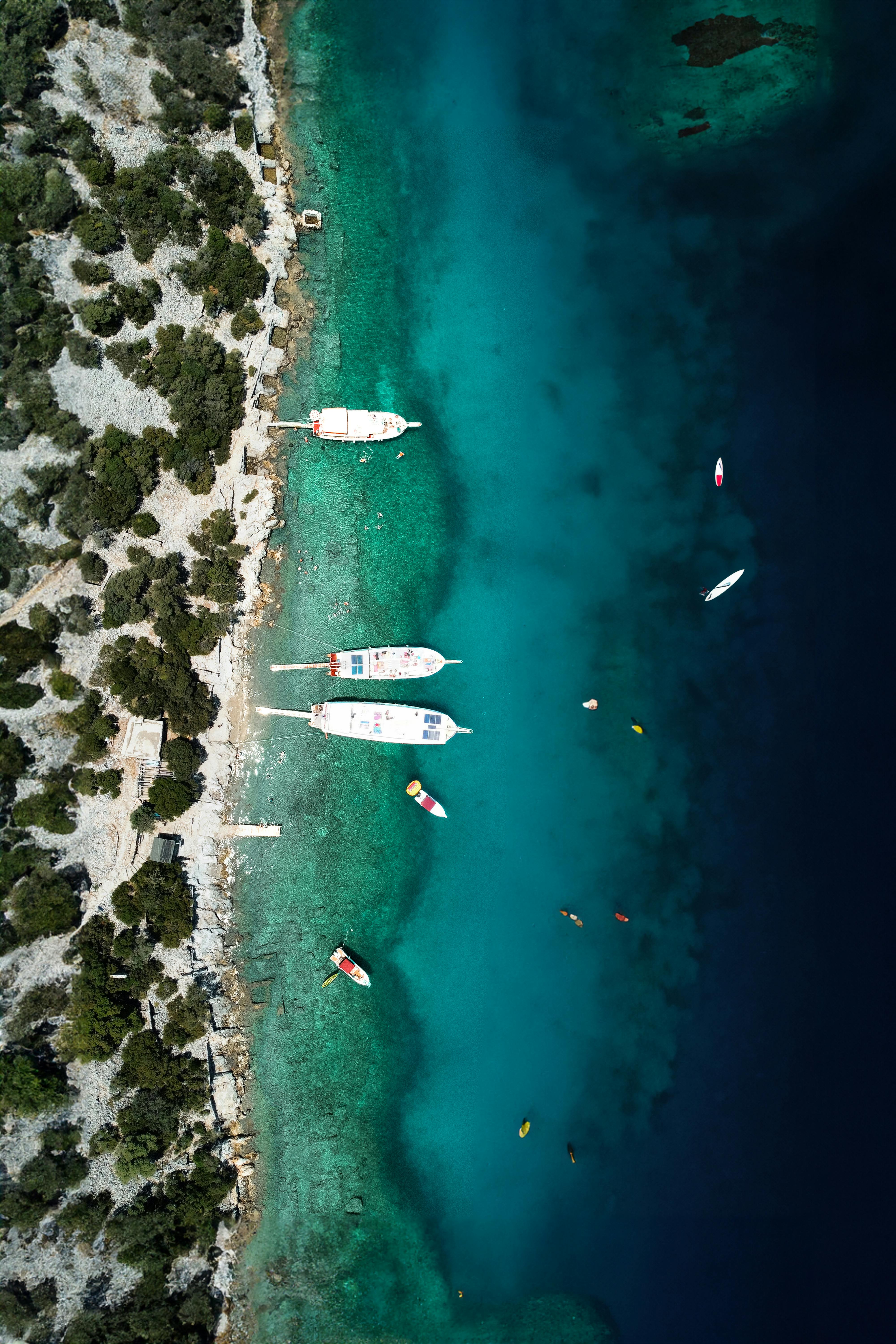 Stunning aerial shot of boats on turquoise waters near Fethiye, Türkiye, capturing the beauty of summer.