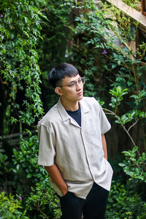 Man in Shirt Standing with Hands in Pockets