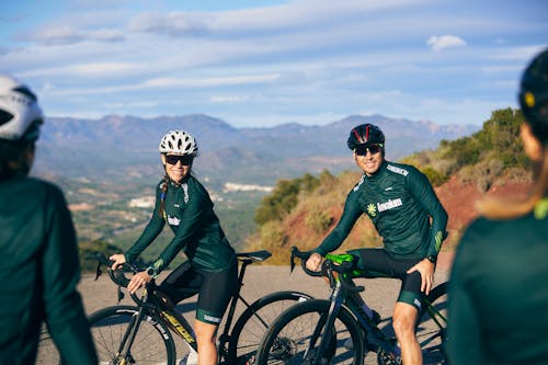 Smiling Woman and Man on Road Bikes 