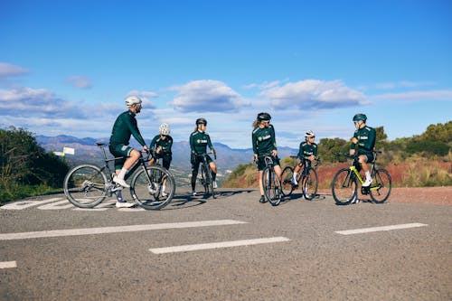 Cyclists Standing on Road