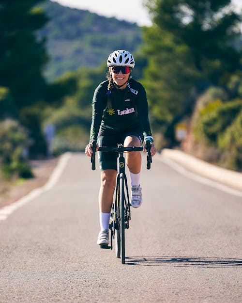 Smiling Woman Riding Road Bike