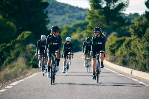 Smiling Cyclists on Road