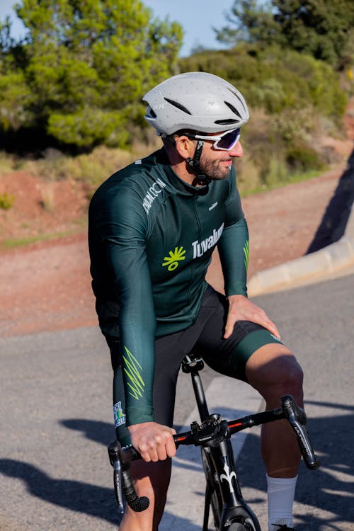 Smiling Cyclist on Road Bike