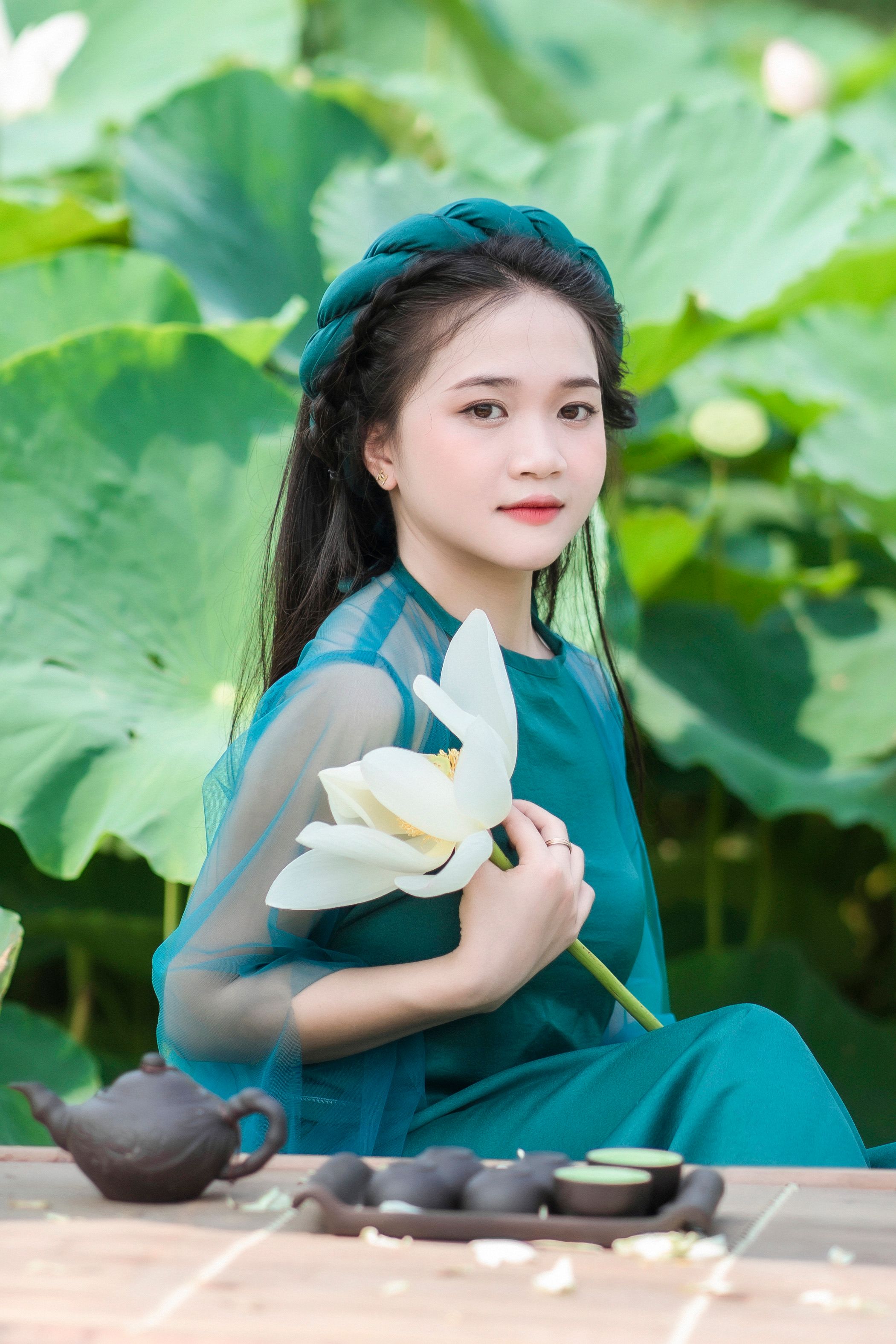 Portrait of a Woman with a Flower · Free Stock Photo