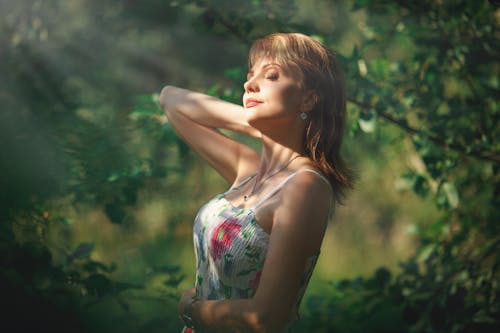 Woman in Sundress among Leaves