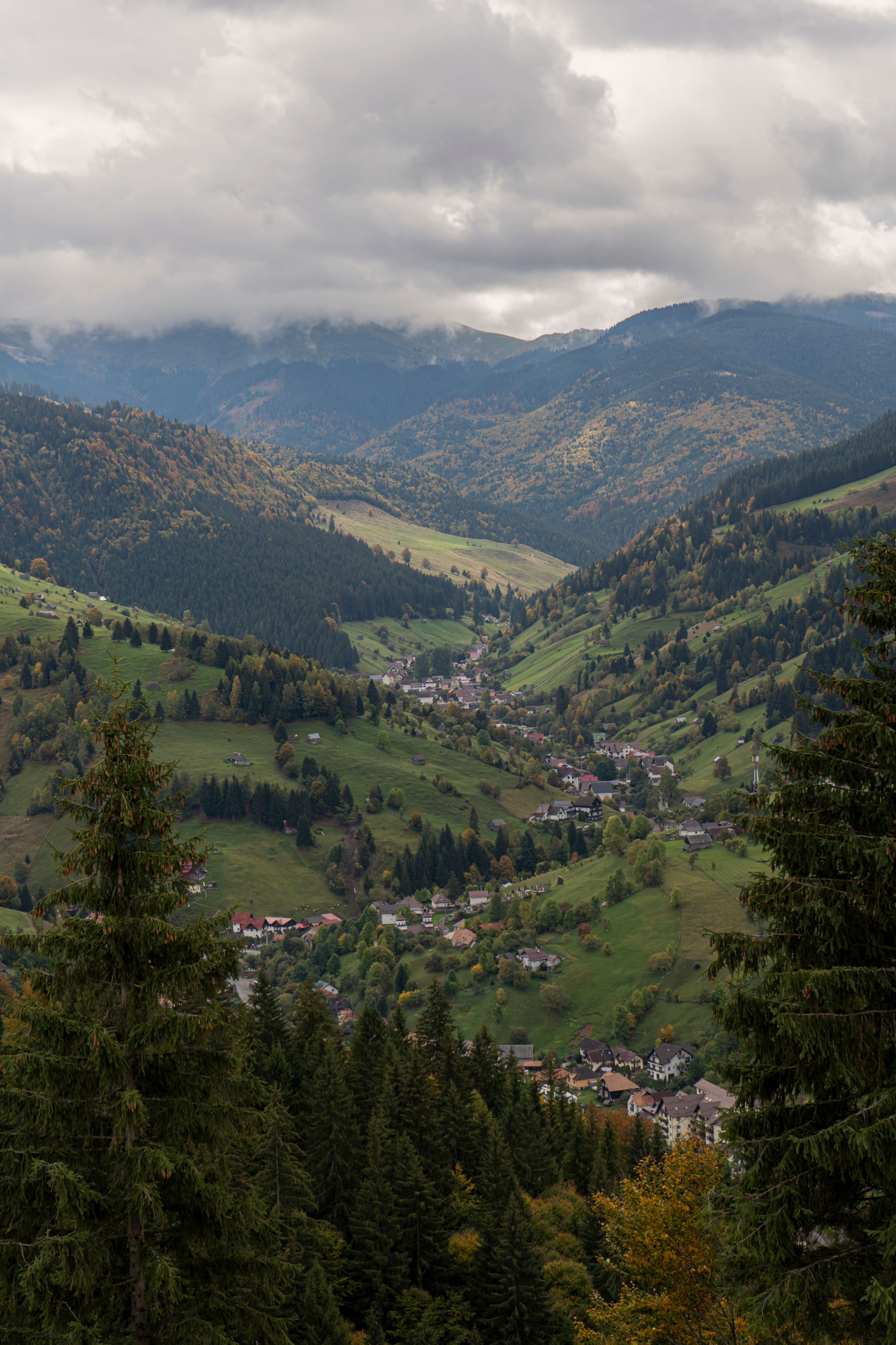 High Angle View of Mountains and a Village in a Valley · Free Stock Photo