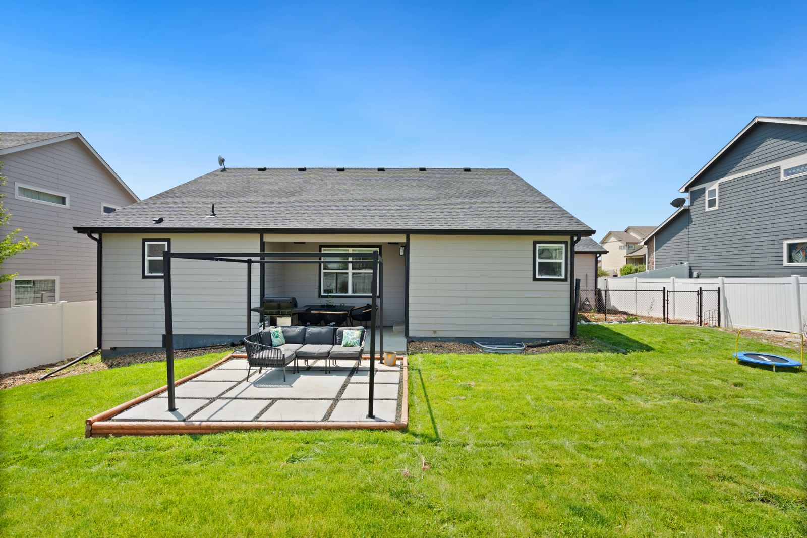Residential concrete patio in a suburban backyard