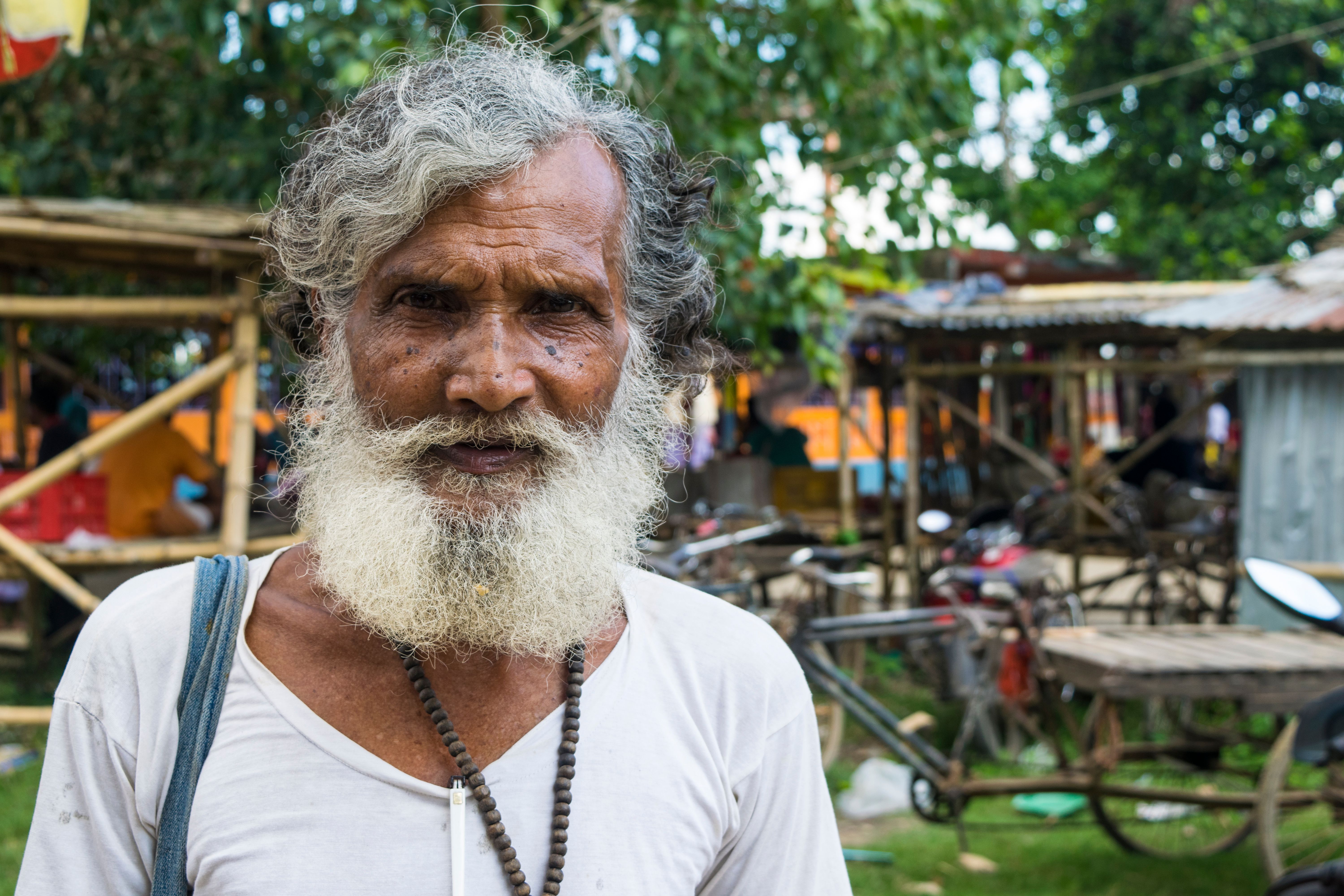 Portrait of an Elderly Man with Prayer Beads on the Neck · Free Stock Photo