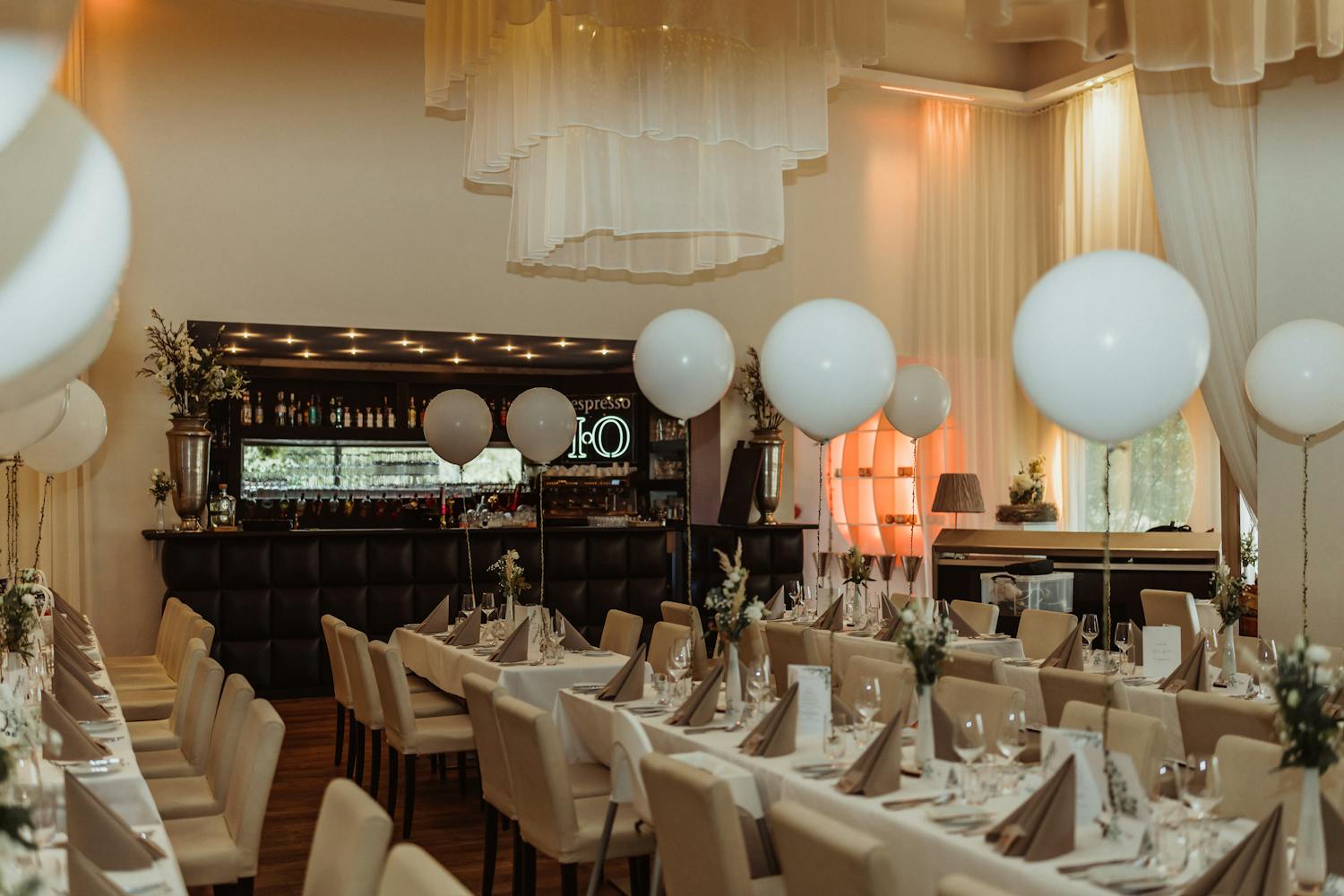 Elegant event setup with balloons and decorations