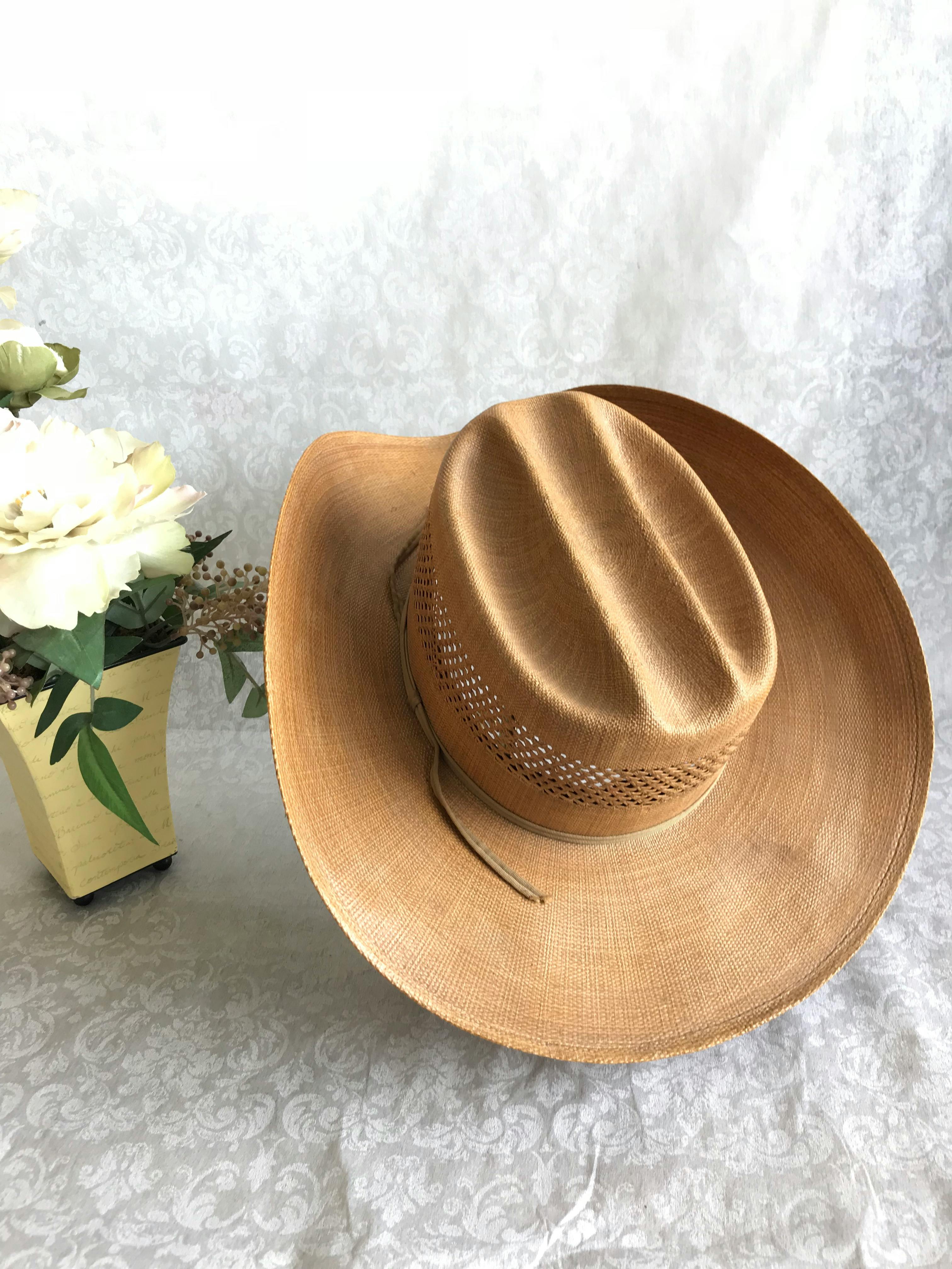 Free stock photo of artificial flowers, cowboy hat, flowers