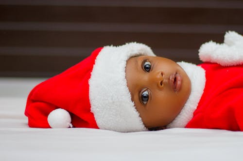 Baby Lying on White Cloth