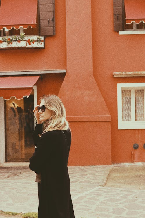 Blonde Woman in Coat and Sunglasses in Town