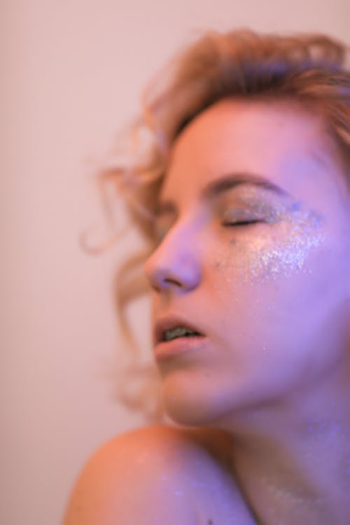 Young Woman with Glitter on her Face 