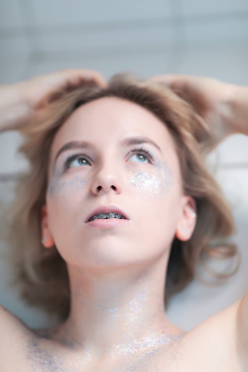 Topless Young Woman with Glitter on Body