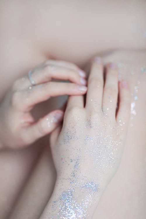 Close-up of Woman with Glitter on Body