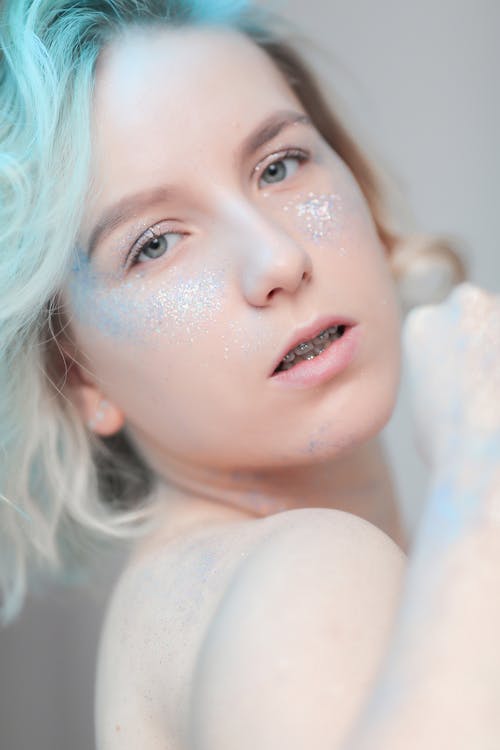 Young Topless Woman with Glitter on Body