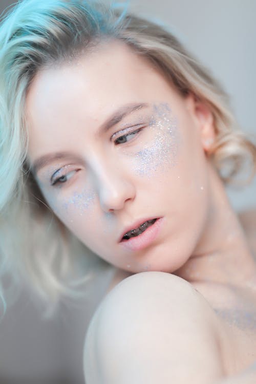 Blonde Woman with Glitter on Face