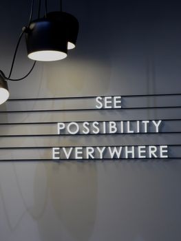 Inspirational message on a stylish wall in a modern interior setting.