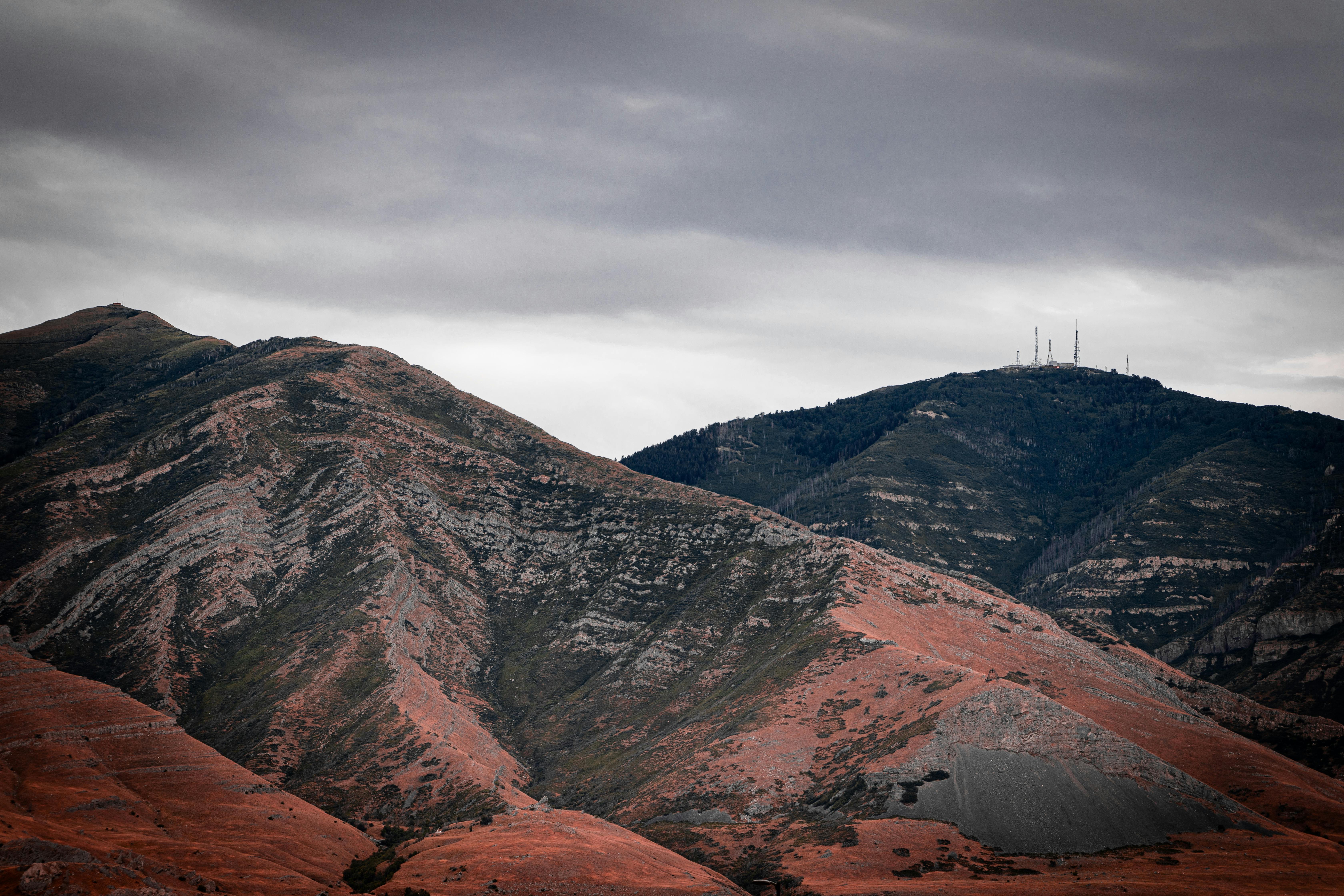 a view of a mountain range with a cloudy sky