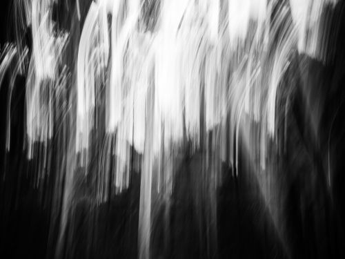 Free Abstract motion blur in black and white with vertical light streaks. Stock Photo