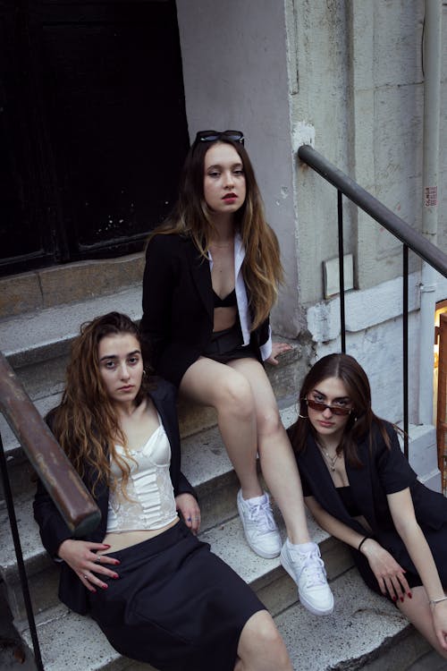 Models Sitting on Stairs