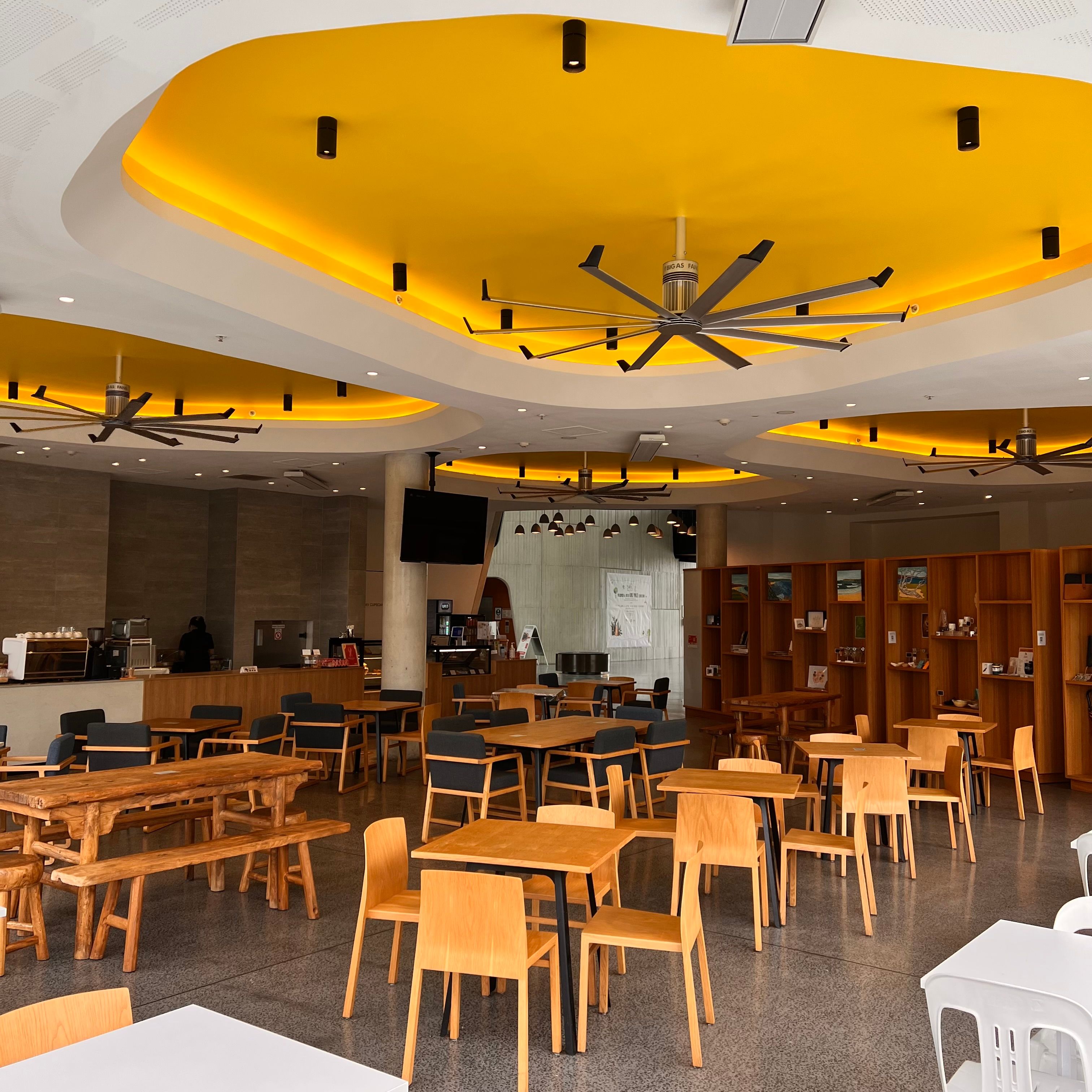 Yellow Ceiling over Tables in Restaurant · Free Stock Photo