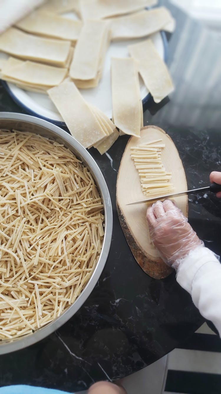 Hand In Glove Cutting And Preparing Pasta