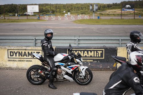 Free Motorcyclists wearing safety gear on a track, showcasing transportation and street sports. Stock Photo