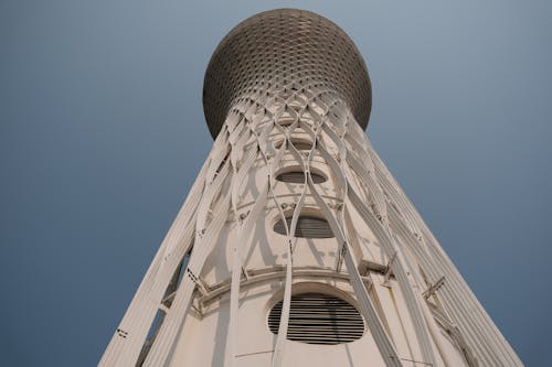 Low Angle Shot of a Modern Tower under Clear Blue Sky 