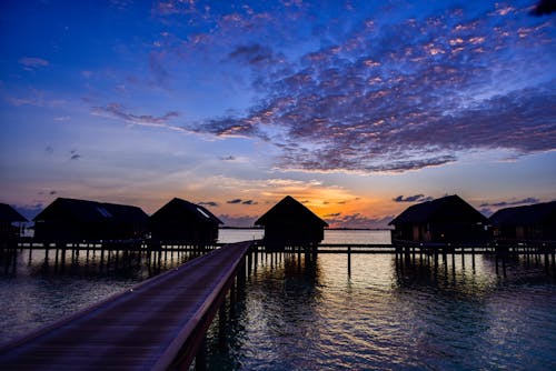 Silhouette of House Near Dock