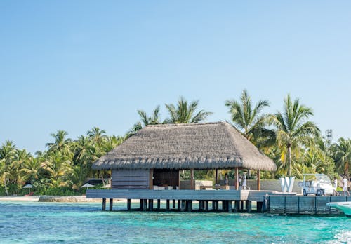 Wooden Cottage Above Water