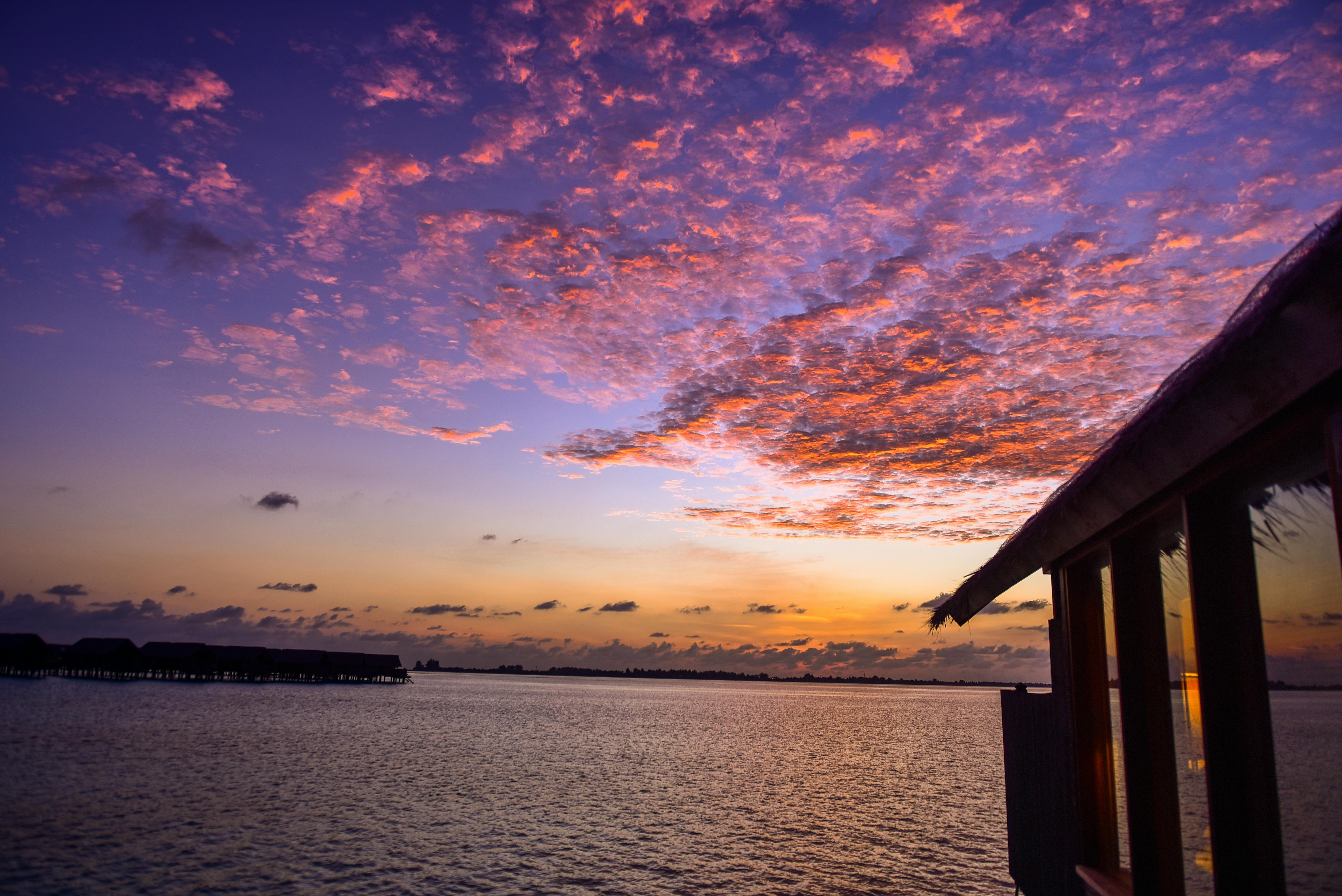 Nipa Hut Near Body Of Water During Golden Hour Free Stock Photo   Pexels Photo 1724429 