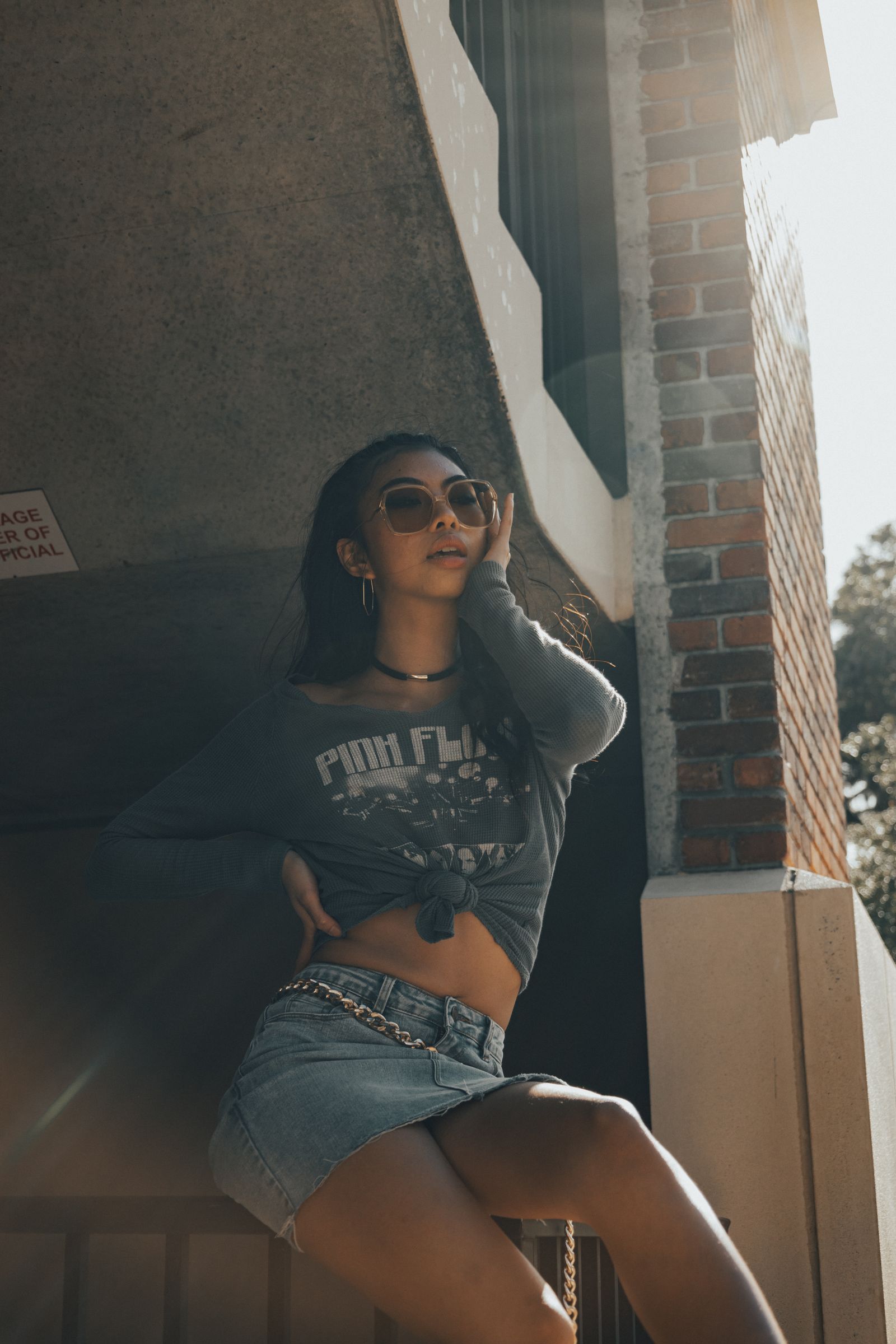 A woman in a crop top and jeans is posing for a photo · Free Stock Photo