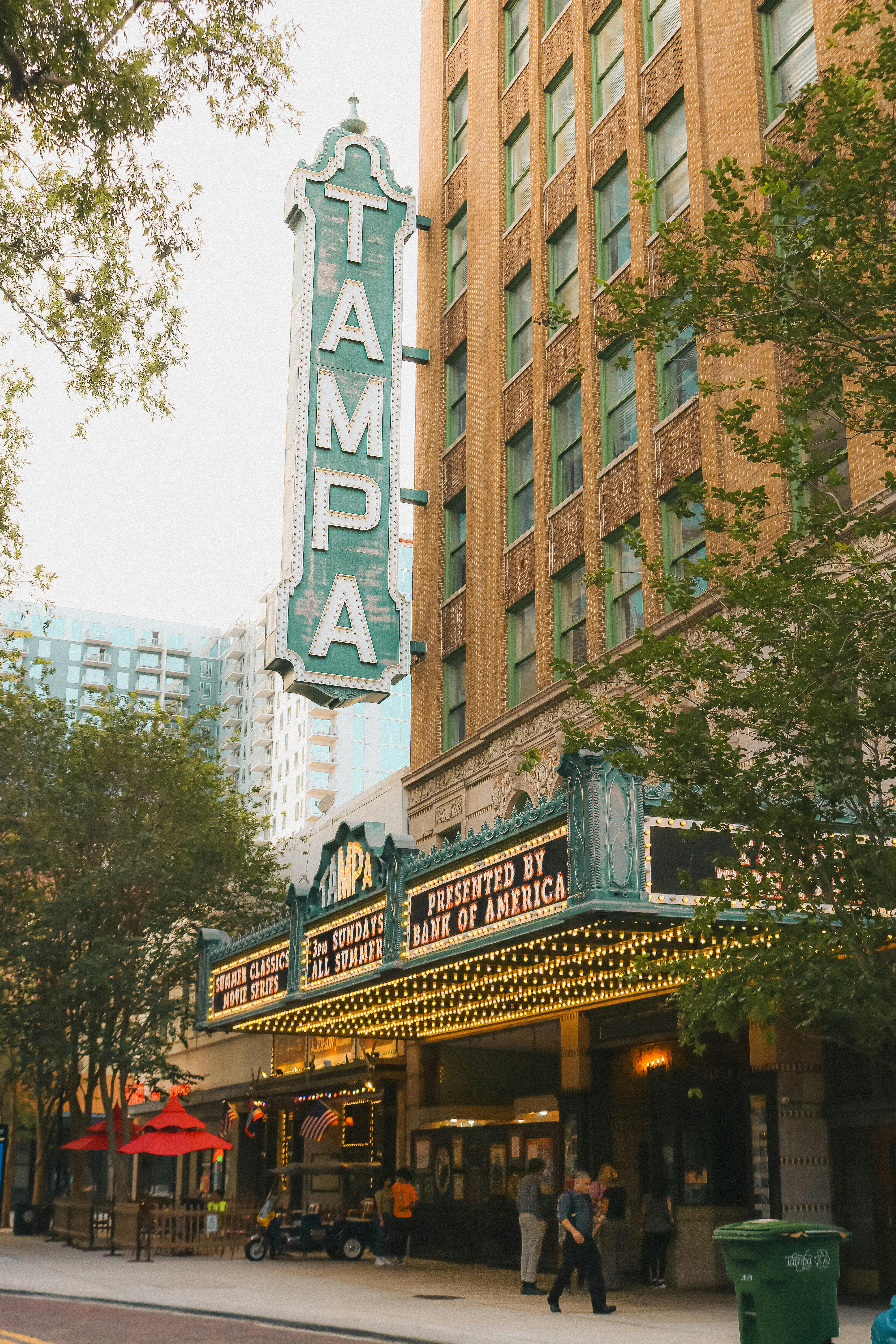 Historic Tampa Theater facade with vibrant signage in downtown Tampa, Florida.