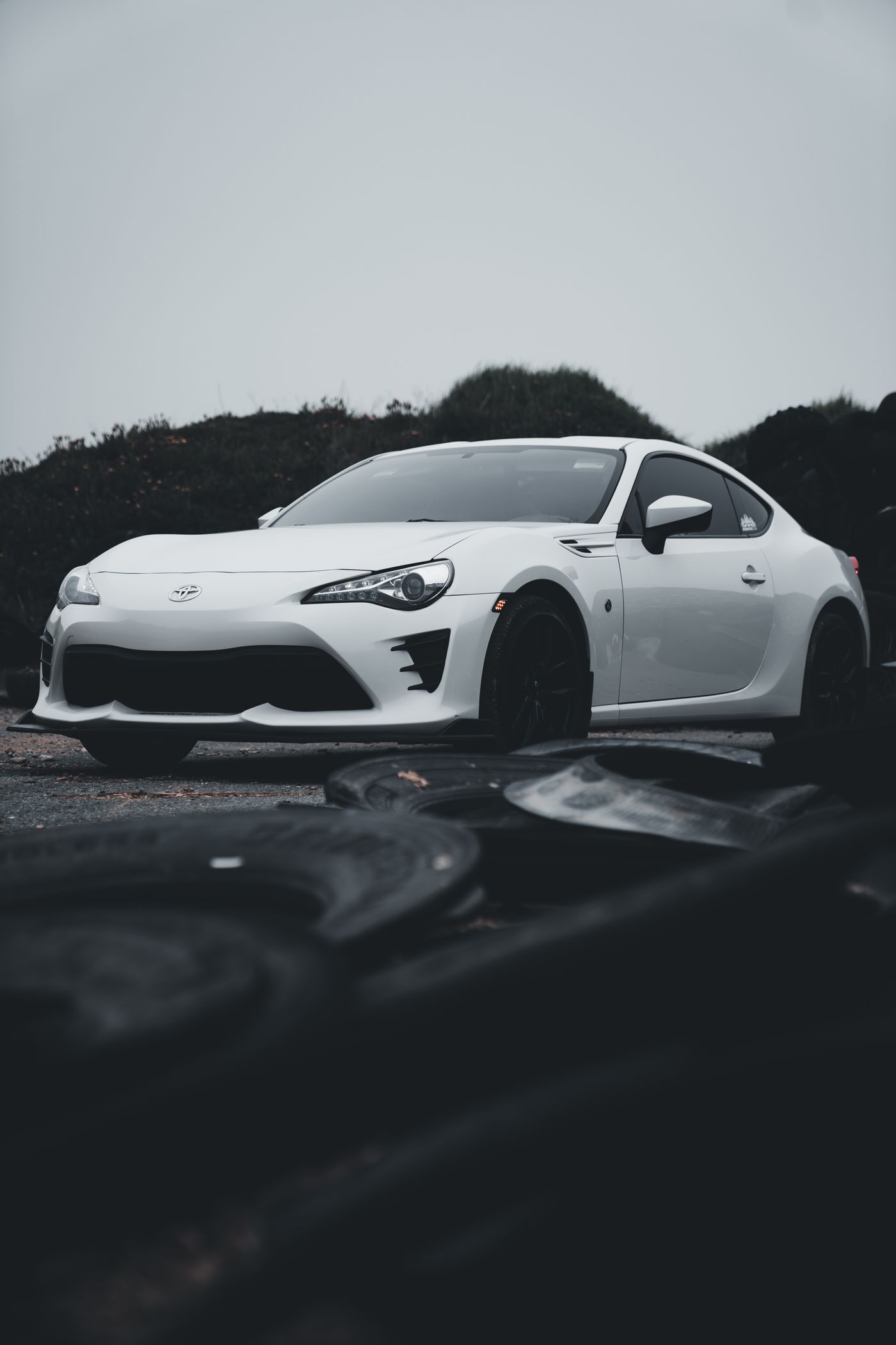 Tuner car at an automotive event showing body and wheel detail