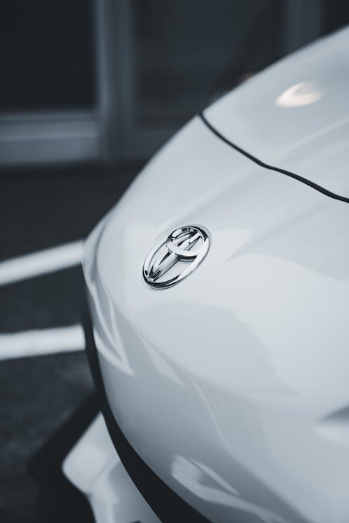 Close-up of the Hood of a White Toyota GT86 on a Parking Lot 