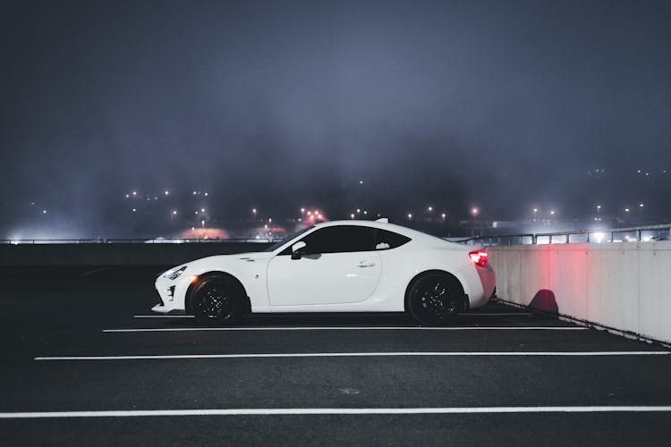 White Car Parked On Rooftop Parking Lot