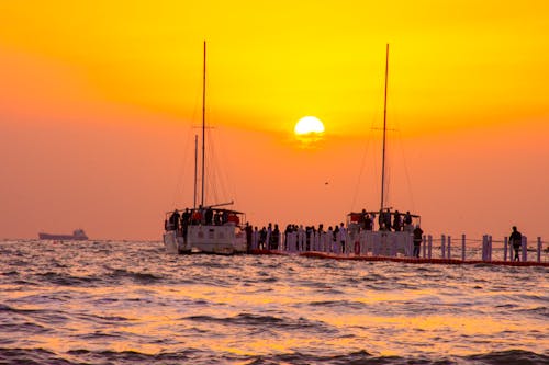 Sailboats in Sea at Scenic Sunset