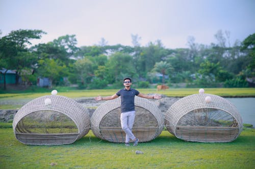 Man Posing with Wicker Baskets